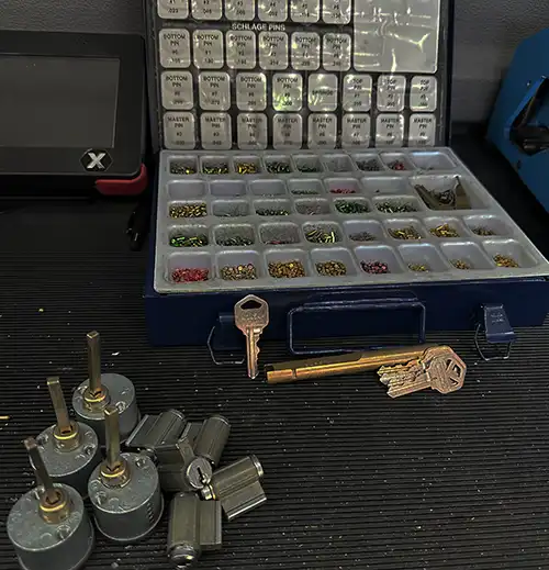 Schlage lock pin kit with key cylinders and rekeying tools for professional locksmiths